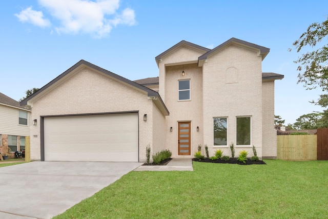 view of front of house with a garage and a front lawn