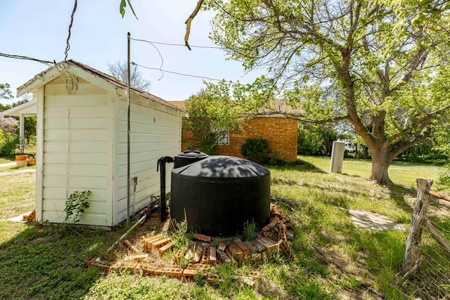 view of outbuilding with a yard