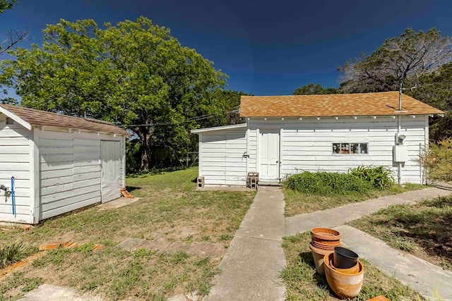 view of outdoor structure with a lawn