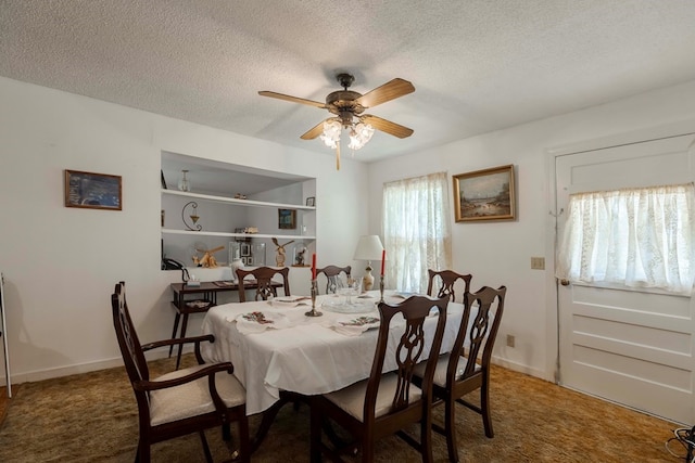 carpeted dining room featuring a textured ceiling and ceiling fan