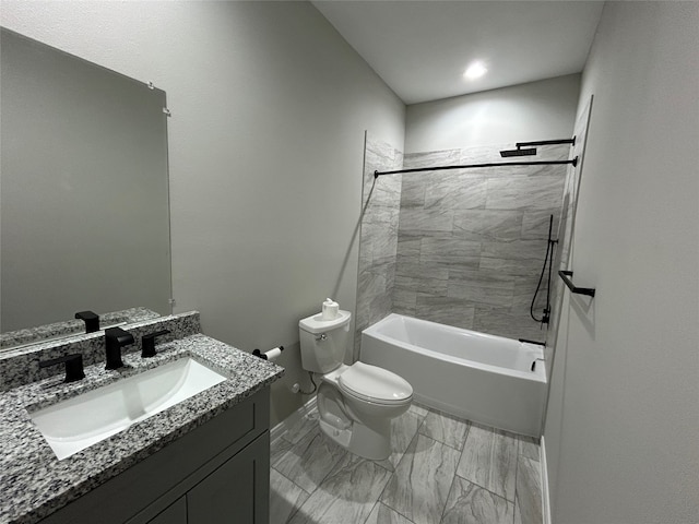 full bathroom featuring toilet, tiled shower / bath combo, and vanity