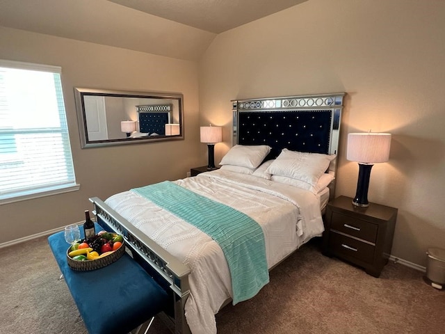 bedroom with lofted ceiling and carpet