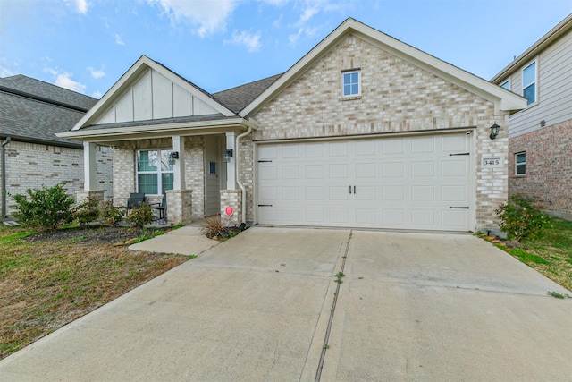 view of front of home with a garage and covered porch