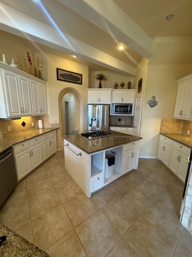 6016 Fm 2720, Maxwell, TX 78656 - kitchen featuring open shelves, stainless steel appliances, tasteful backsplash, a center island, and white cabinets