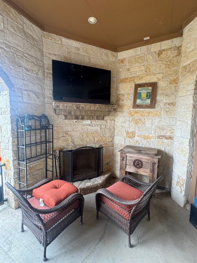 view of patio / terrace with a stone fireplace