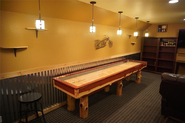 6016 Fm 2720, Maxwell, TX 78656 - game room featuring a wainscoted wall, carpet, and lofted ceiling
