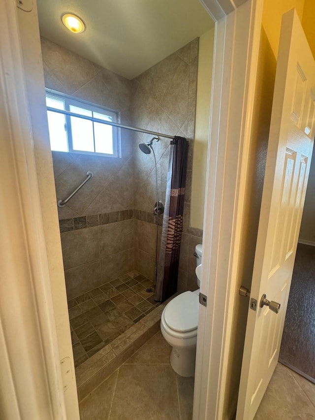 6016 Fm 2720, Maxwell, TX 78656 - bathroom featuring toilet, a shower stall, and tile patterned flooring