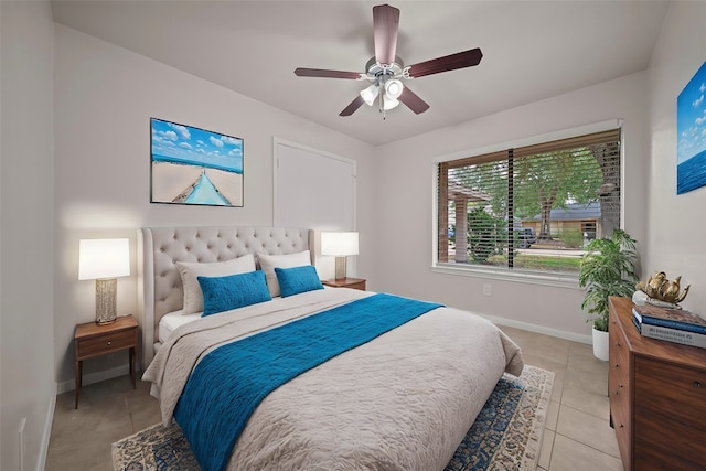 tiled bedroom with ceiling fan