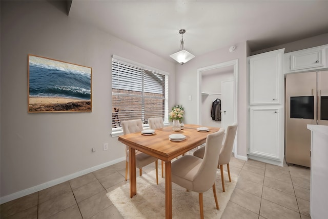 dining area with light tile patterned floors