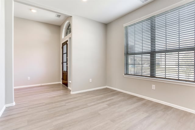 unfurnished room featuring light wood-type flooring