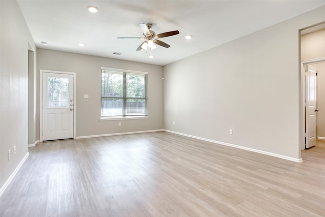 unfurnished room with ceiling fan and light hardwood / wood-style flooring