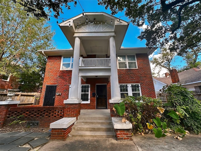 view of front of home with a balcony