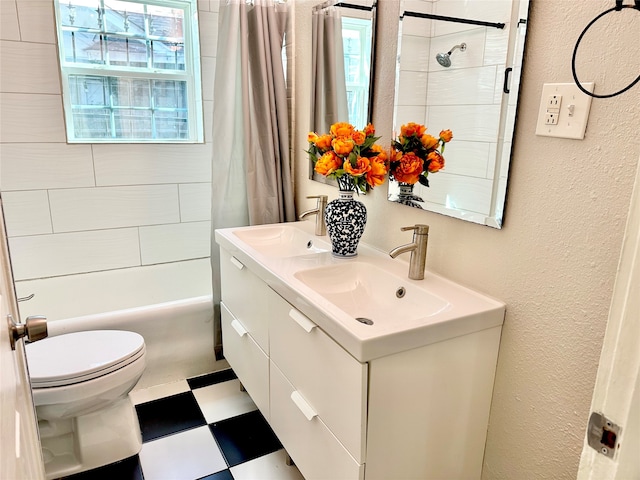 full bathroom with shower / tub combo with curtain, vanity, and toilet