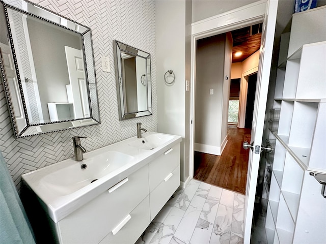 bathroom with vanity and wood-type flooring