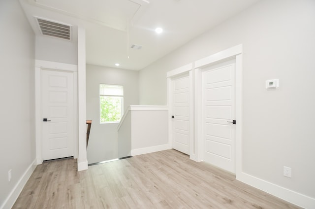 unfurnished room featuring light wood-type flooring