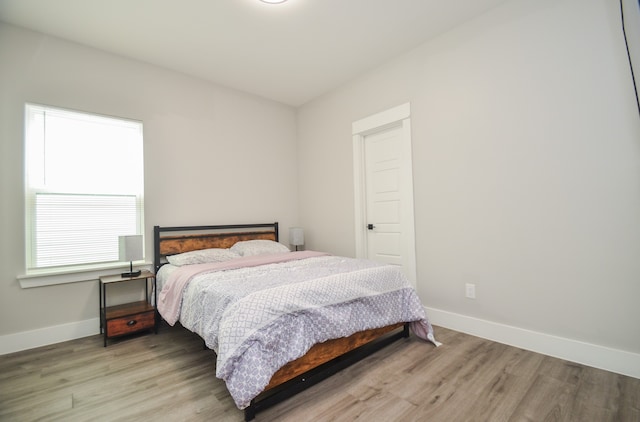 bedroom with light hardwood / wood-style floors