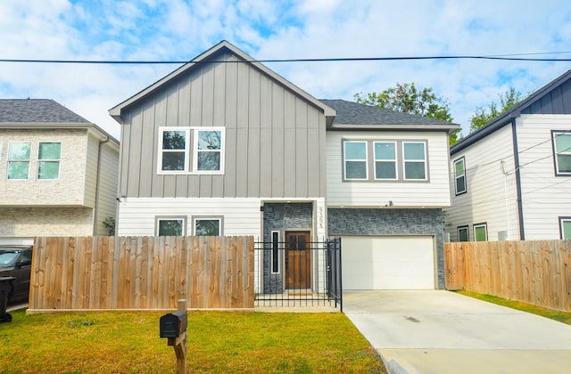 view of front facade featuring a garage and a front lawn