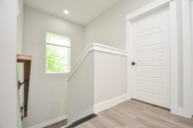 stairs with wood-type flooring