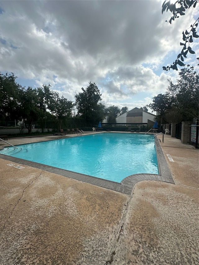 view of pool featuring a patio