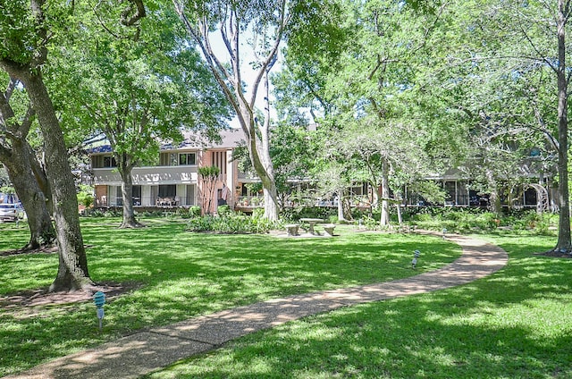 view of home's community featuring a yard