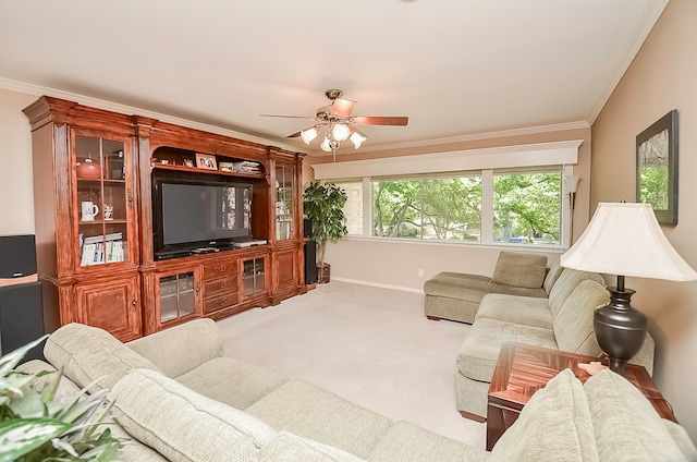 carpeted living room featuring ceiling fan and crown molding