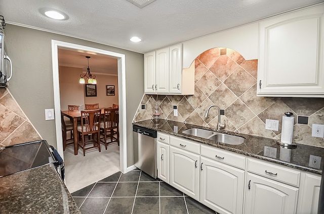 kitchen with white cabinetry, stainless steel dishwasher, decorative light fixtures, and sink