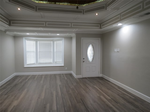 foyer with dark wood-type flooring, a wealth of natural light, and crown molding