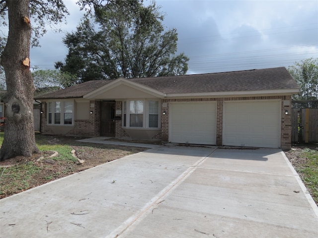 single story home featuring a garage