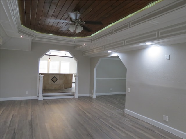 additional living space with ceiling fan, hardwood / wood-style flooring, and wooden ceiling