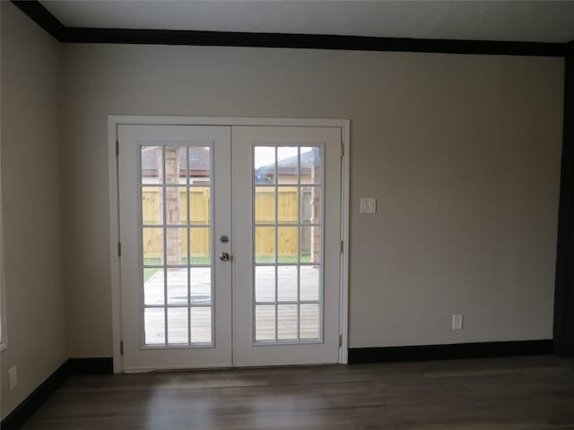 doorway to outside with dark hardwood / wood-style flooring, french doors, and crown molding