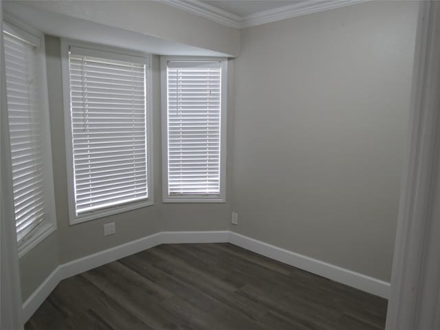 unfurnished room featuring dark hardwood / wood-style floors and crown molding