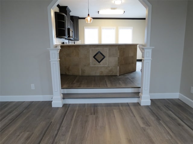 interior details featuring hardwood / wood-style flooring and ornamental molding