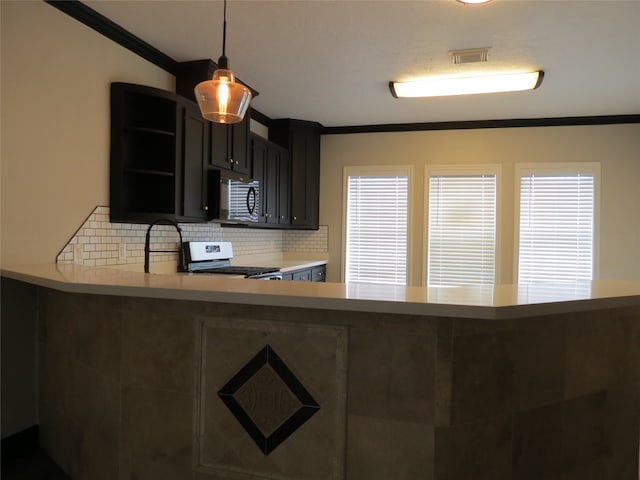 kitchen featuring sink, range with electric stovetop, ornamental molding, backsplash, and pendant lighting