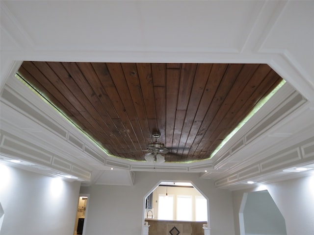 details with ornamental molding and ceiling fan