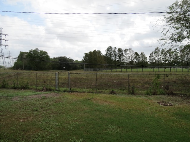 view of yard with a rural view