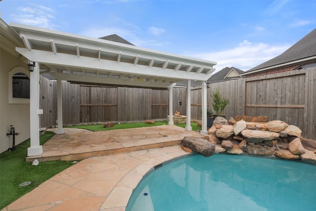 view of pool with a pergola and a patio area