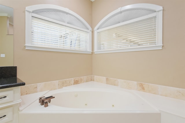 bathroom with vanity and a bathtub