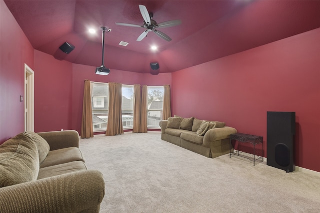 home theater room featuring carpet, vaulted ceiling, and ceiling fan