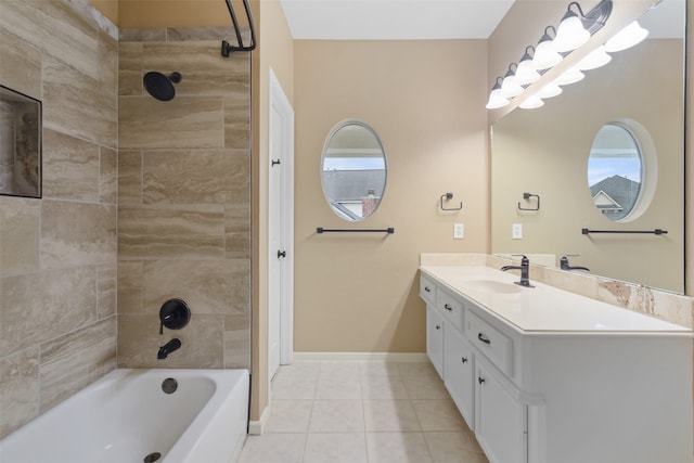 bathroom with vanity, tile patterned flooring, plenty of natural light, and tiled shower / bath combo