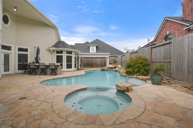 view of pool with a patio area, a gazebo, and an in ground hot tub