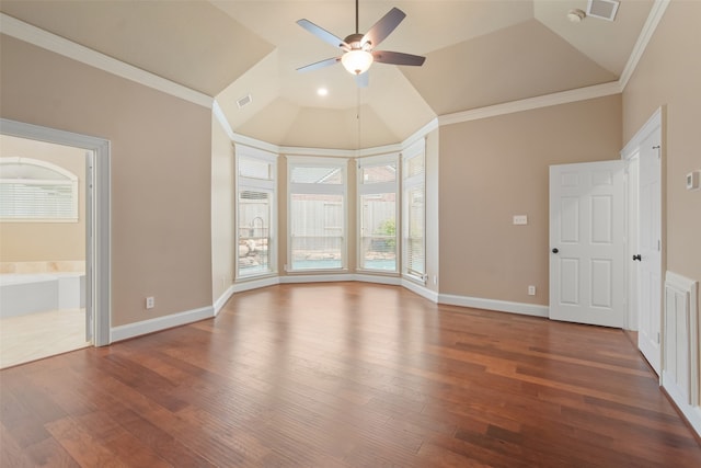 interior space with hardwood / wood-style flooring, ceiling fan, vaulted ceiling, and crown molding