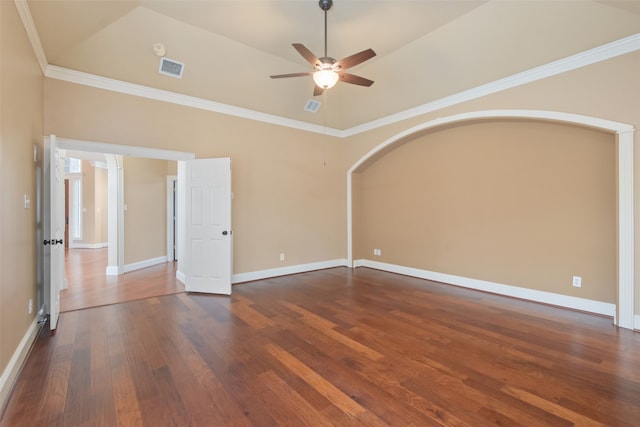 unfurnished room with ceiling fan, lofted ceiling, dark hardwood / wood-style floors, and crown molding