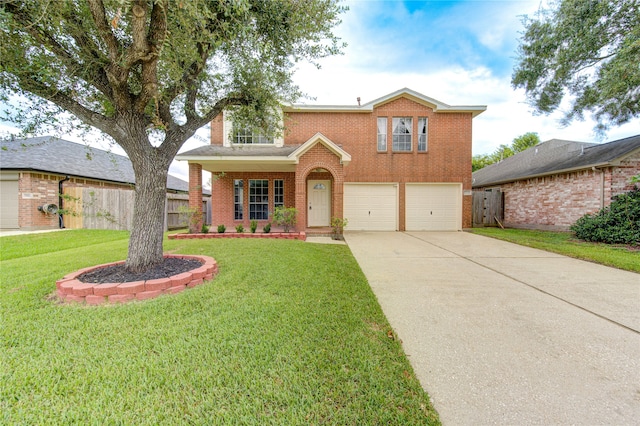 view of front property featuring a garage and a front yard