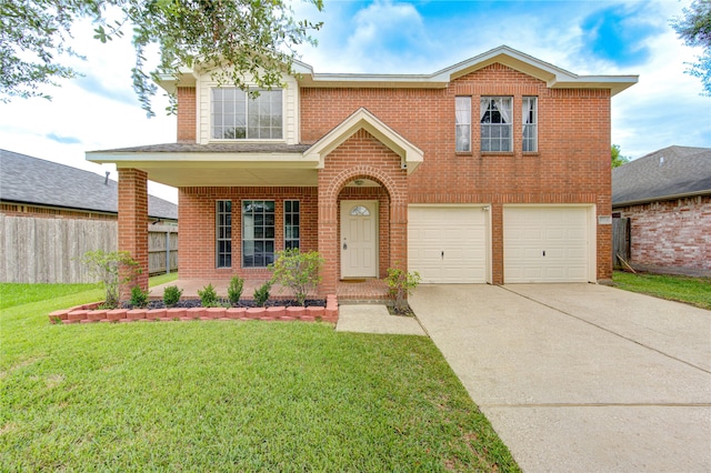 view of front of property with a garage and a front yard