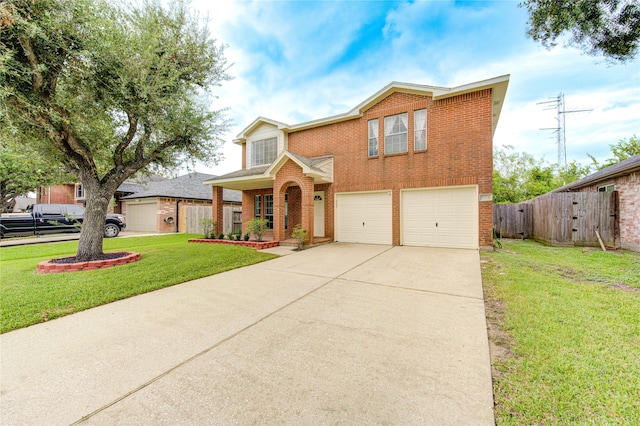 view of property featuring a garage and a front yard