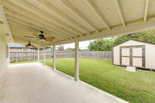 view of patio / terrace with a shed and ceiling fan