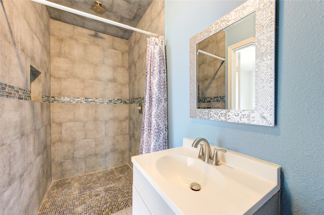 bathroom featuring vanity and a shower with curtain