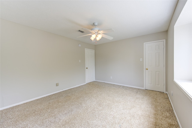 unfurnished room featuring carpet floors and ceiling fan