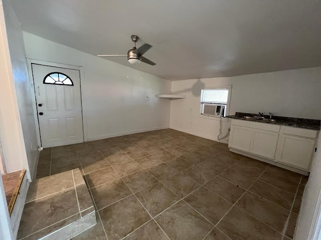 interior space with cooling unit, sink, vaulted ceiling, and ceiling fan