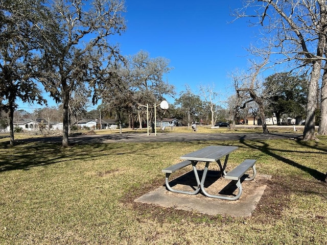 view of property's community with a yard